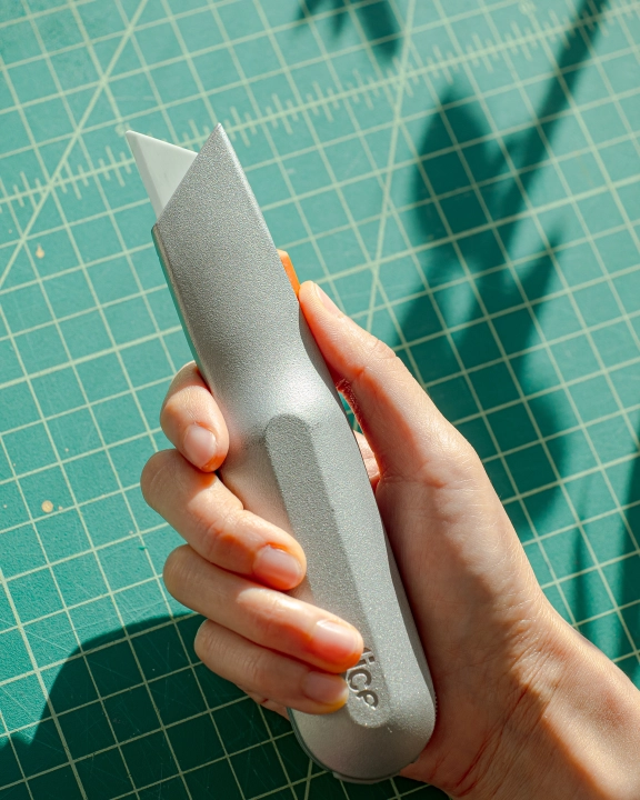 Slice Manual Metal-Handle Utility Knife in hand